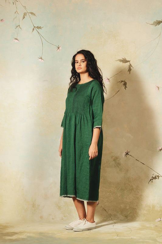 Dve emerald green linen Raka dress pintucked bodice, selvedge details.