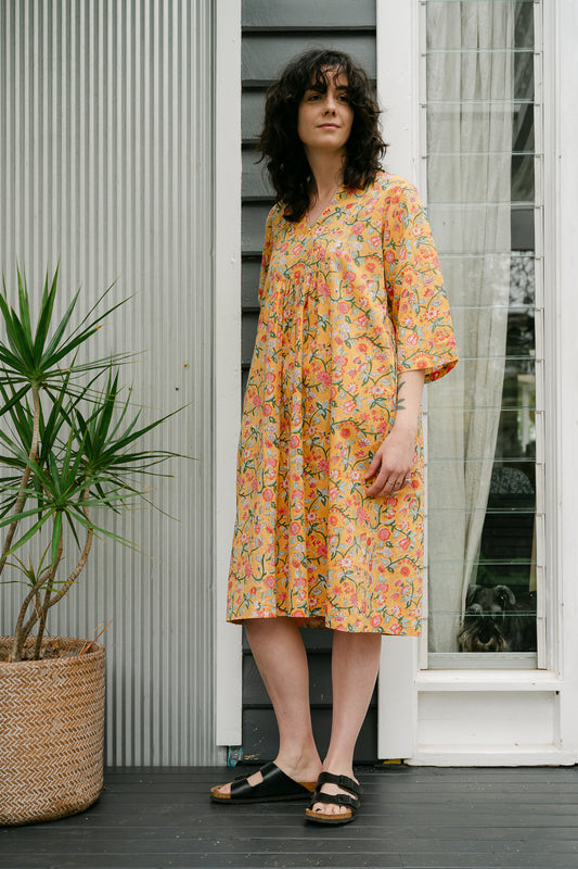 Juniper Hearth blockprint cotton Thea 3/4 sleeve dress in saffron yellow floral design.
