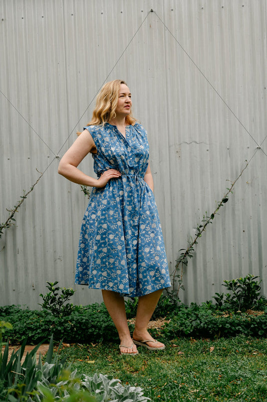 Juniper Hearth Zoe blockprint floral sleeveless cotton dress, buttonup with waist tie, in blue and white.