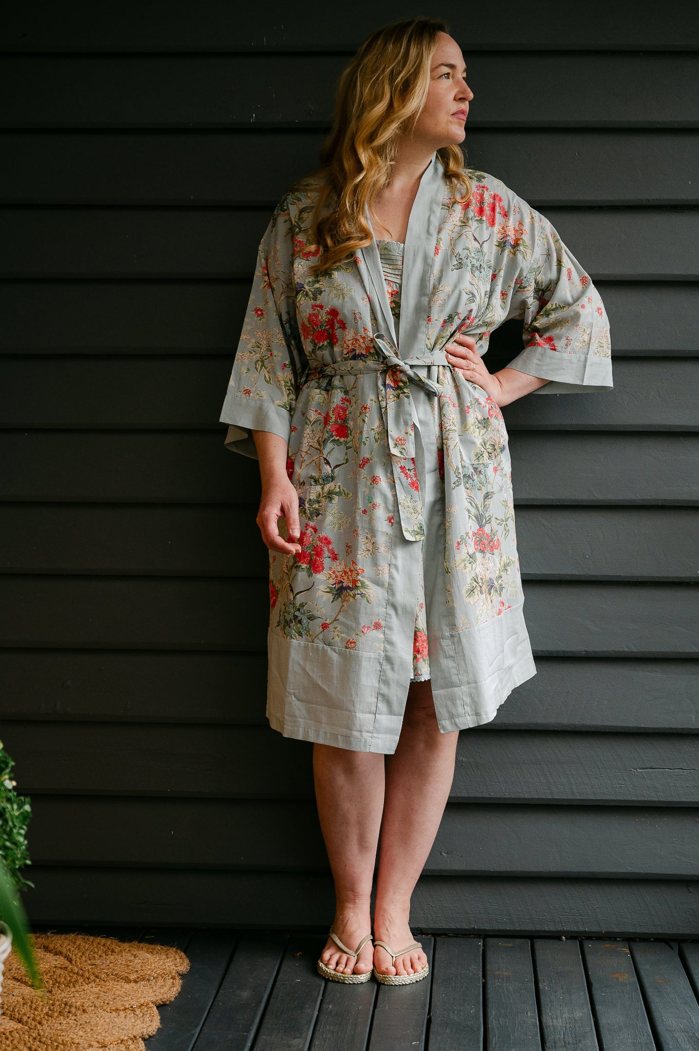 Juniper Hearth cotton voile kimono in country garden print, pink and vanilla flowers on duck egg blue background.