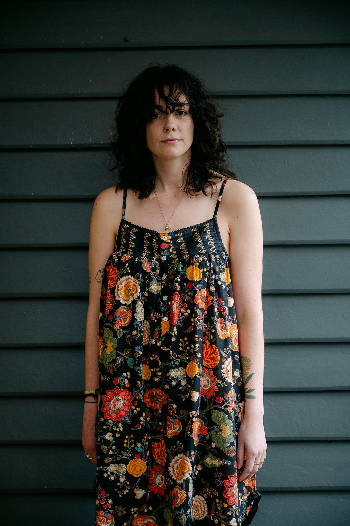 Juniper Hearth cotton voile nightdress in a vibrant all over tropical floral in coral, ecru and olive green on a black background