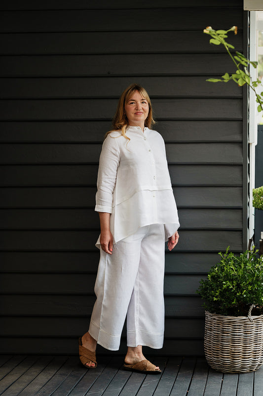 Manan Anaya white linen shirt with tailored seam detailing.