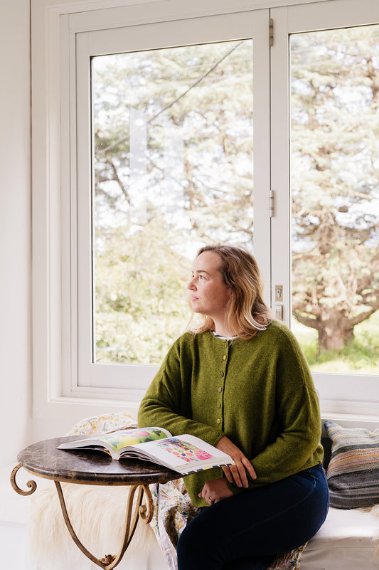 Baby yak one size reversible cardigan sweater with hand embroidered buttons in chartreuse green.