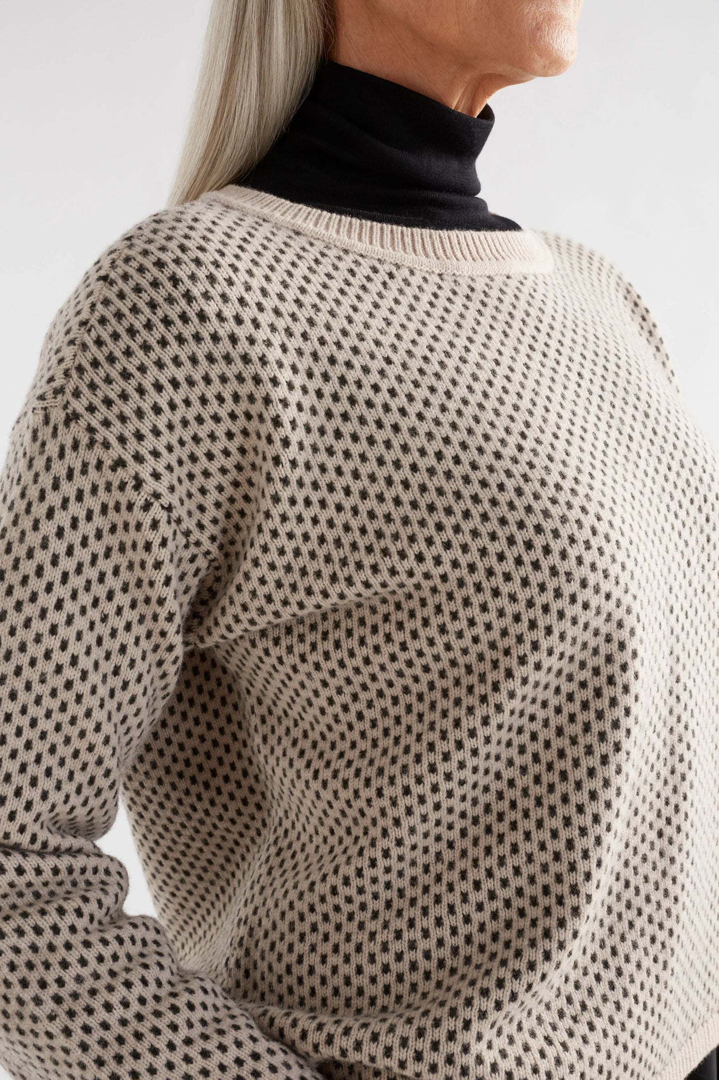 Elk the Label Bis sweater in merino and recycled nylon, dot stitch fawn and loden green.