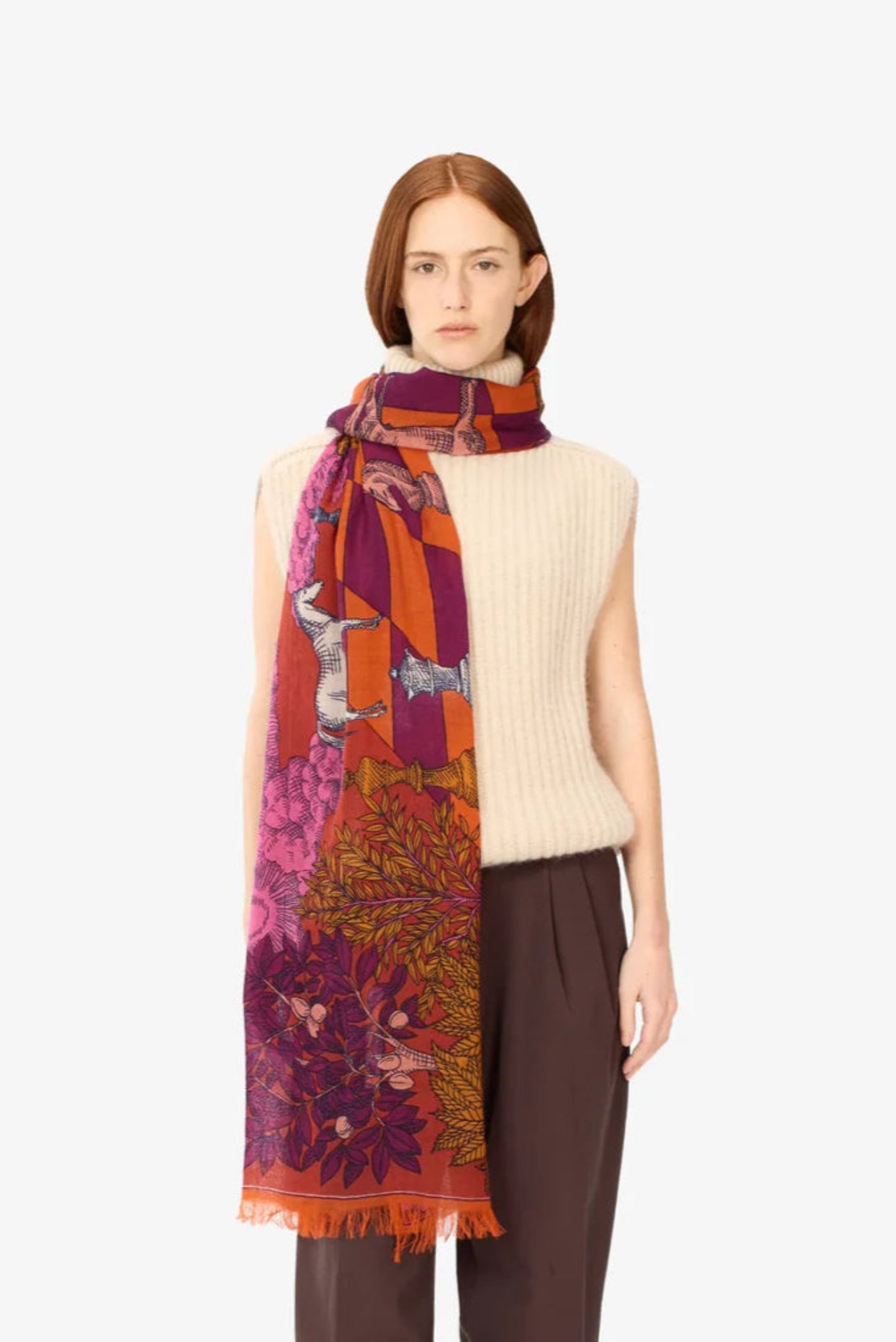 Inoui Editions Magnus wool scarf in red, featuring animals on a giant chess board.