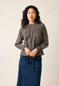 Nancybird Rowena black and white check blouse with shirred neckline and long sleeves with shirred cuffs.