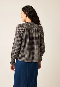 Nancybird Rowena black and white check blouse with shirred neckline and long sleeves with shirred cuffs.