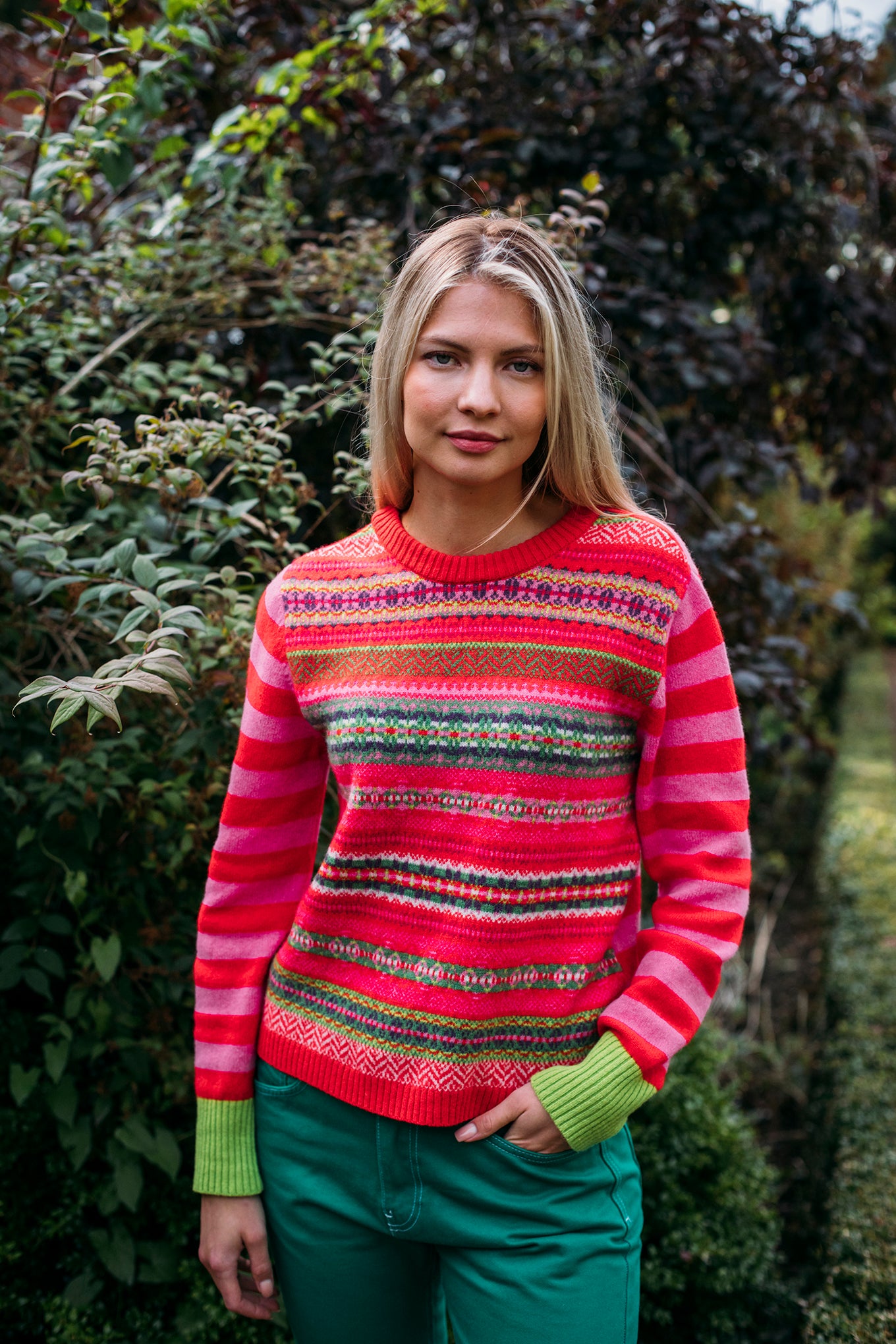 Eribe Stobo reversible fairisle and stripe sweater in soft lambswool, Rosa in pink and re with highlights of orange, lime and leaf green.