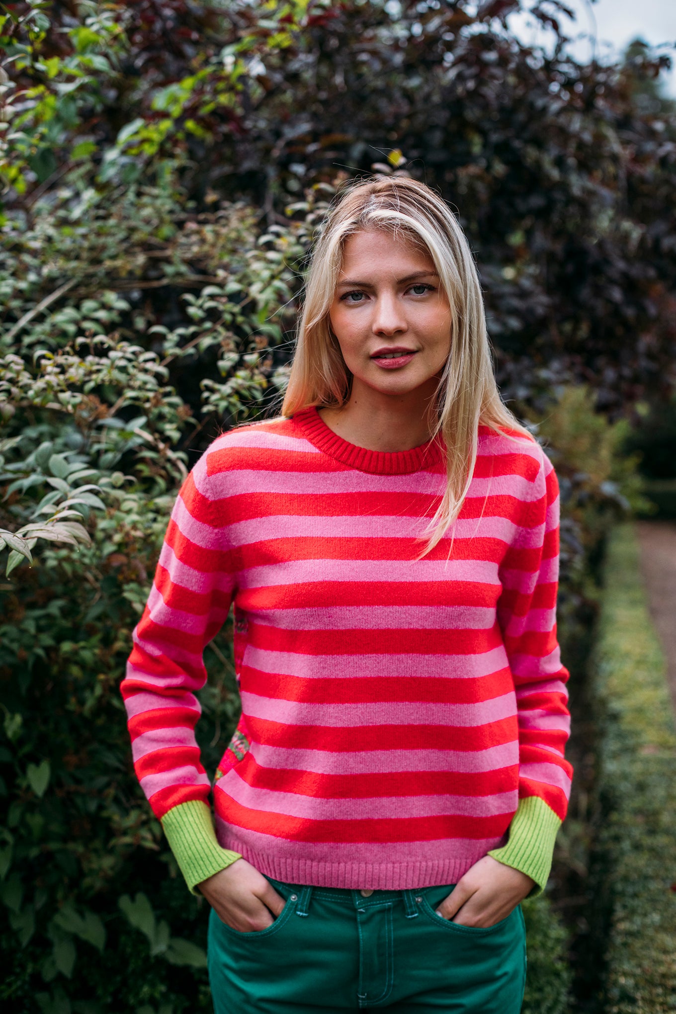 Eribe Stobo reversible fairisle and stripe sweater in soft lambswool, Rosa in pink and re with highlights of orange, lime and leaf green.