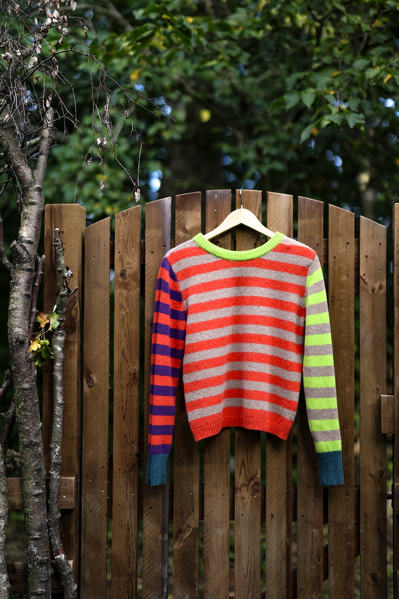 Eribe Stobo stripe reversible lambswool sweater in Luscious, lime and lavender and orange and purple and teal.