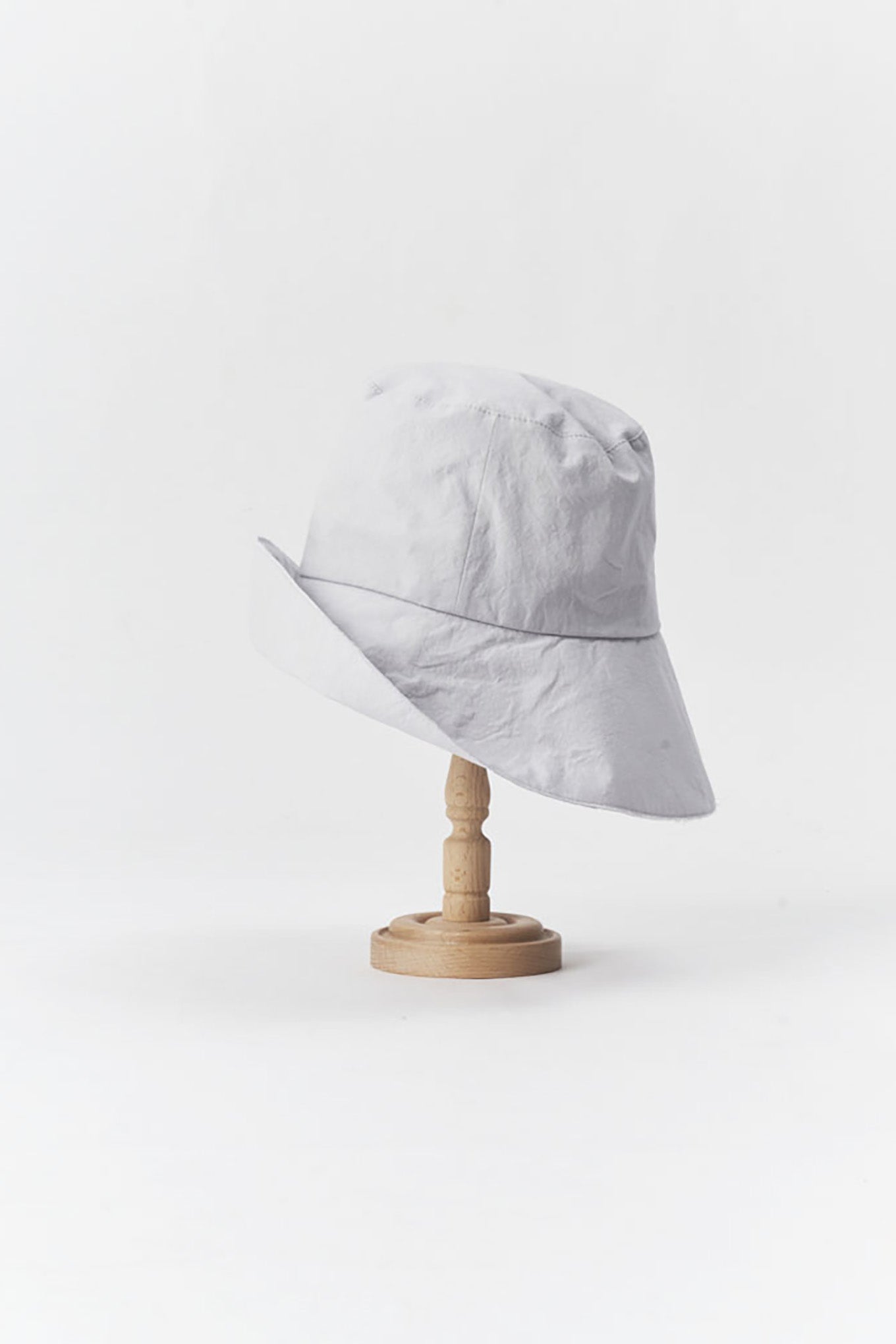 PCNQ made in Japan cotton bucket hat with generous brim in light grey.