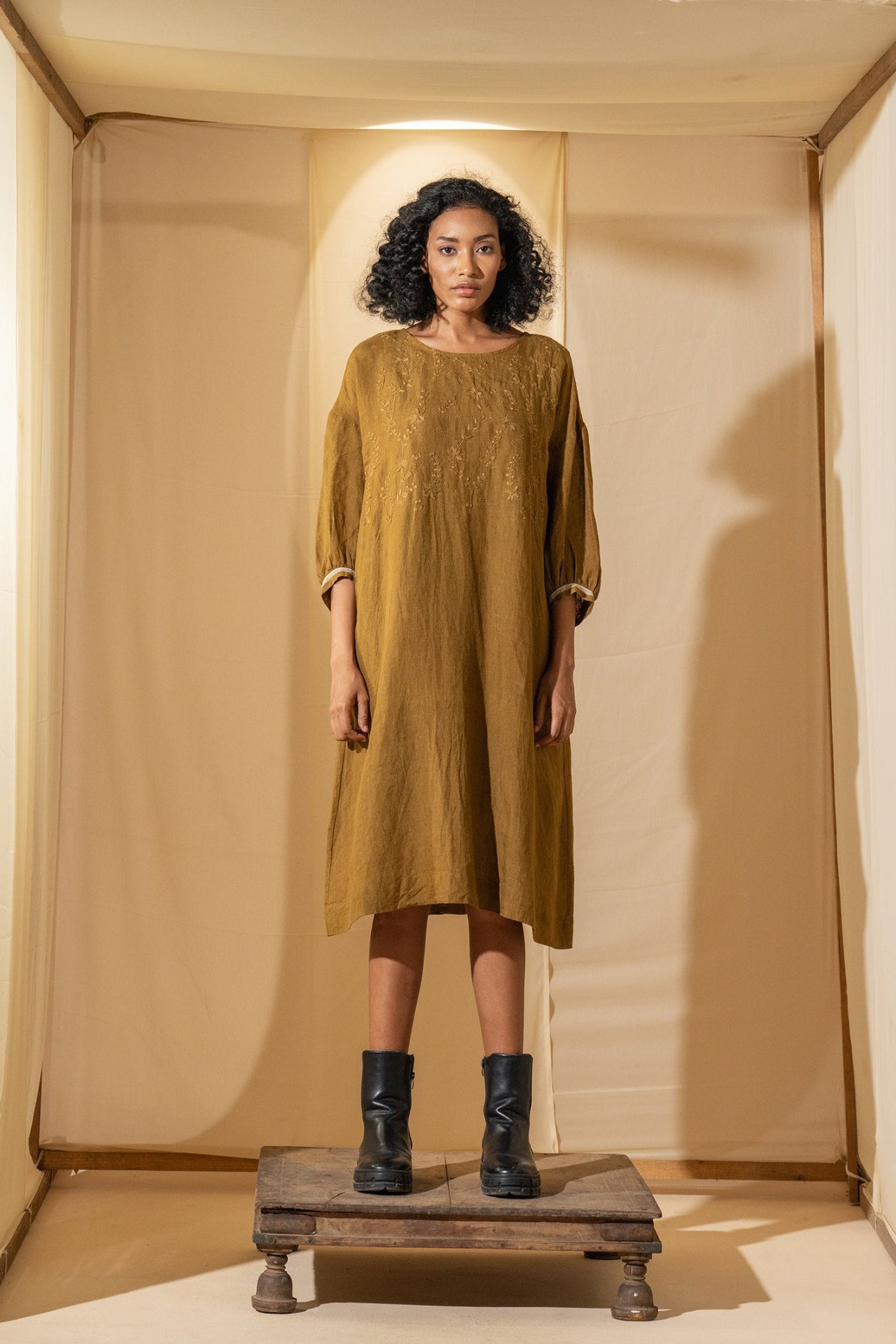 DVE Viha dress in handloom hand embroidered linen, A-line shape in mustard.