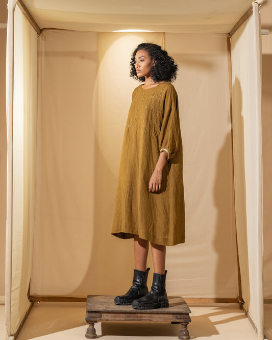 DVE Viha dress in handloom hand embroidered linen, A-line shape in mustard.