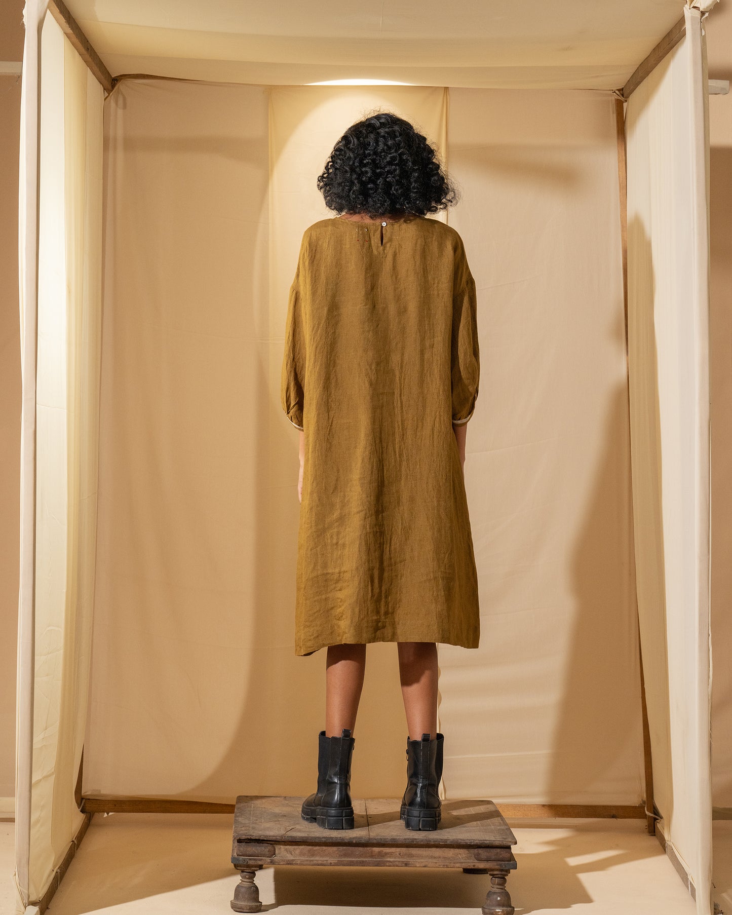 DVE Viha dress in handloom hand embroidered linen, A-line shape in mustard.