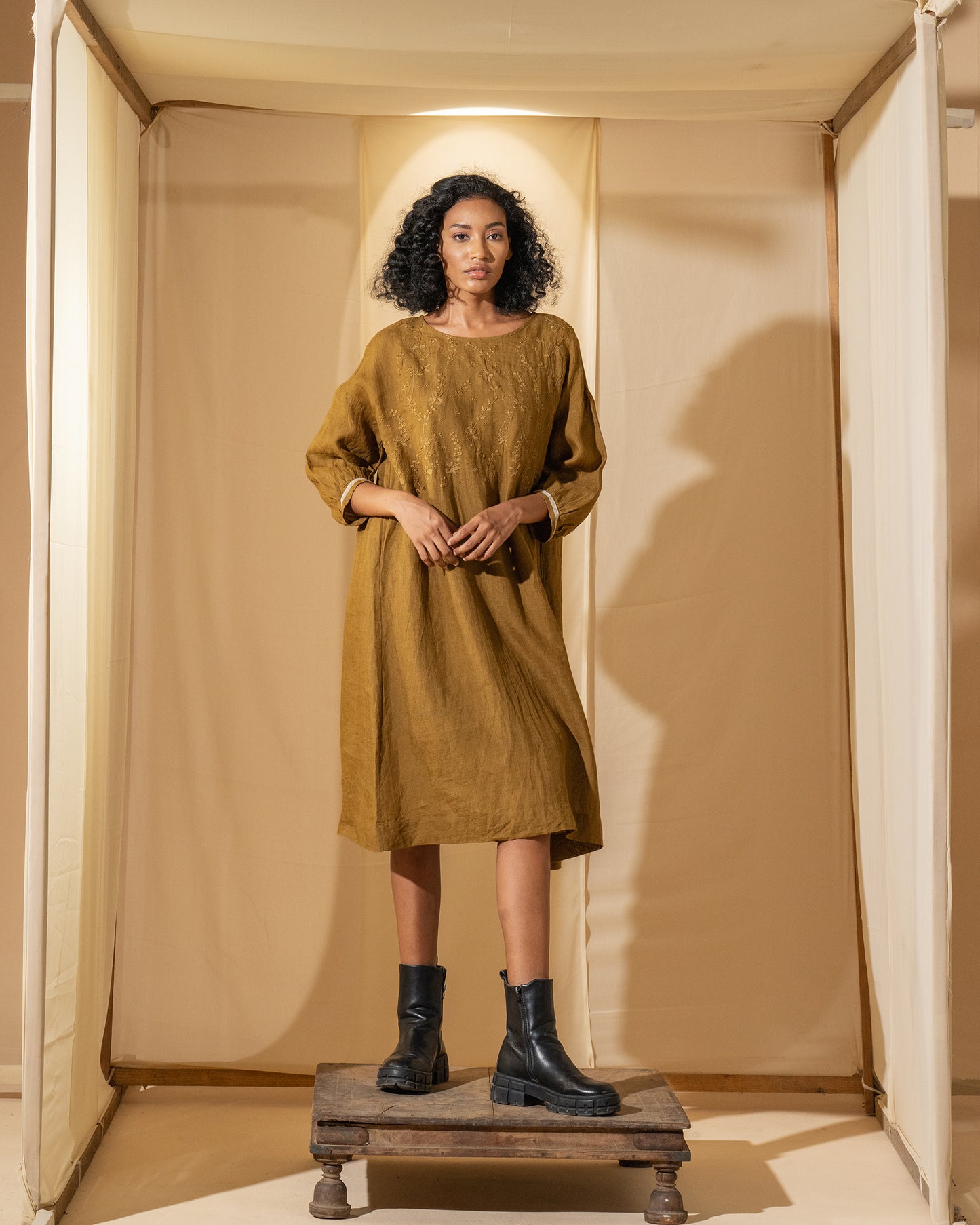 DVE Viha dress in handloom hand embroidered linen, A-line shape in mustard.