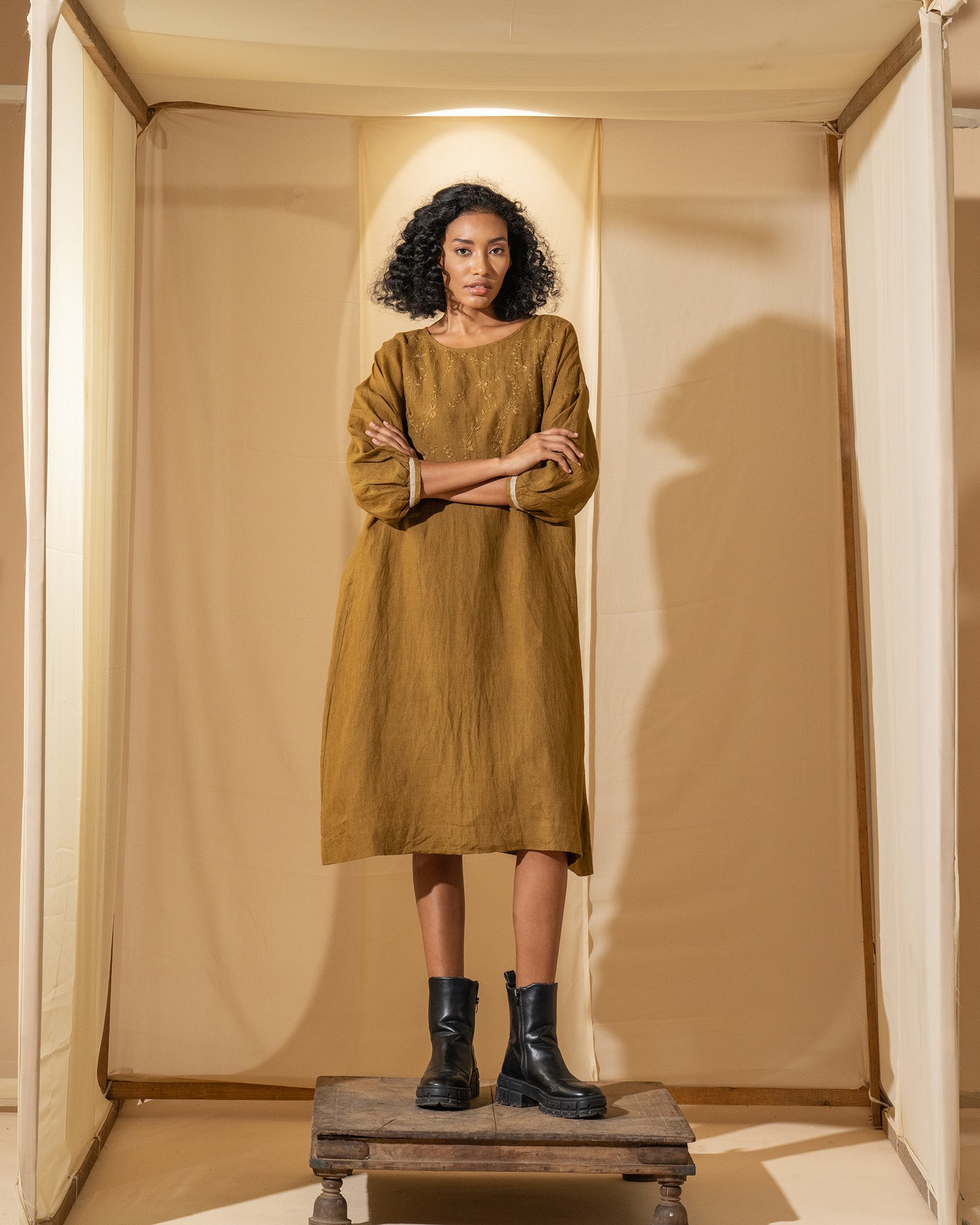 DVE Viha dress in handloom hand embroidered linen, A-line shape in mustard.