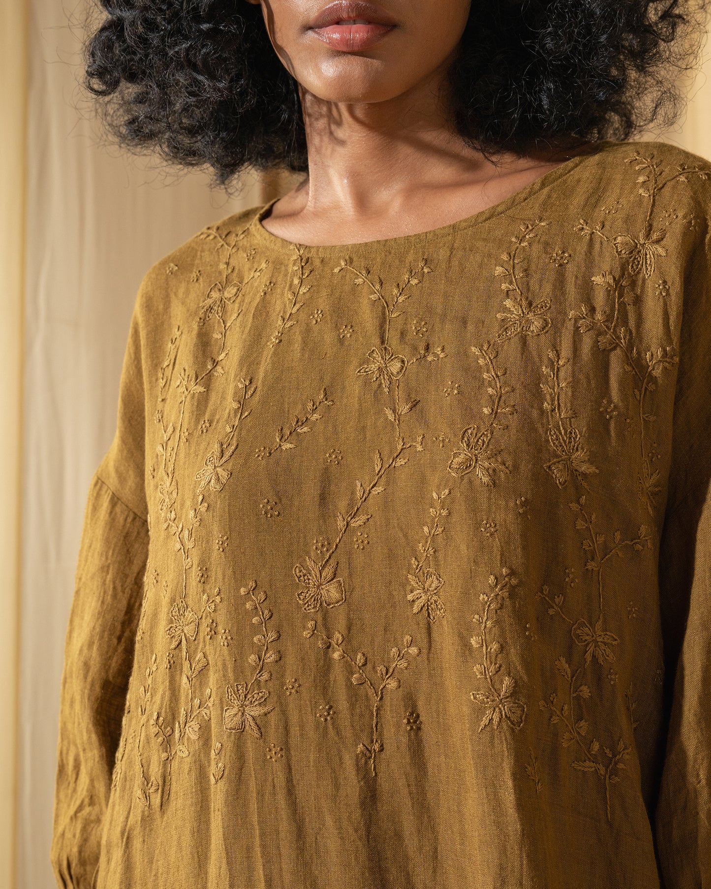 DVE Viha dress in handloom hand embroidered linen, A-line shape in mustard.