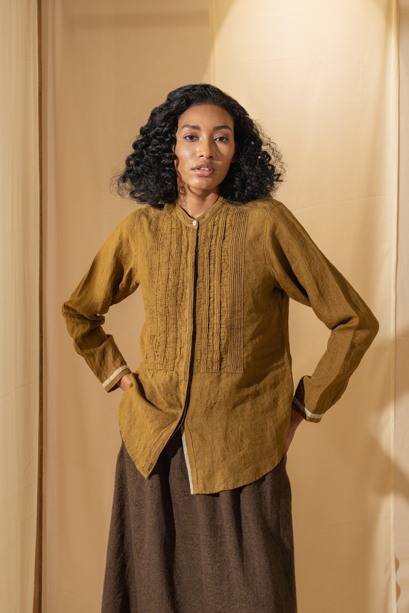 DVE Gargi blouse with pintucked and ruched details in mustard handloom linen.