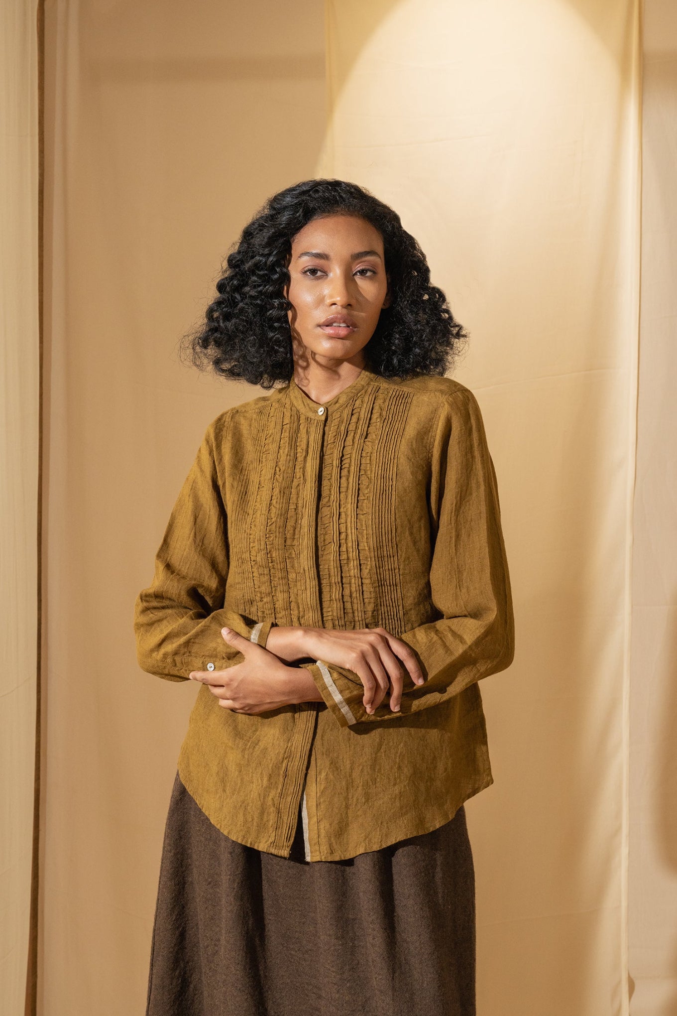DVE Gargi blouse with pintucked and ruched details in mustard handloom linen.
