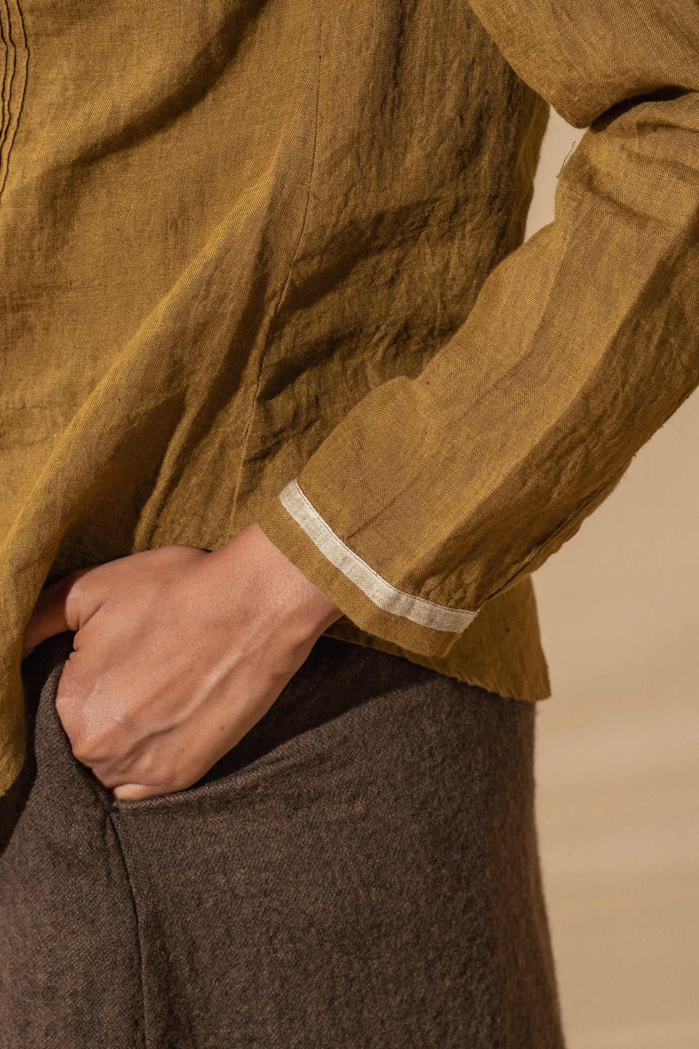 DVE Gargi blouse with pintucked and ruched details in mustard handloom linen.