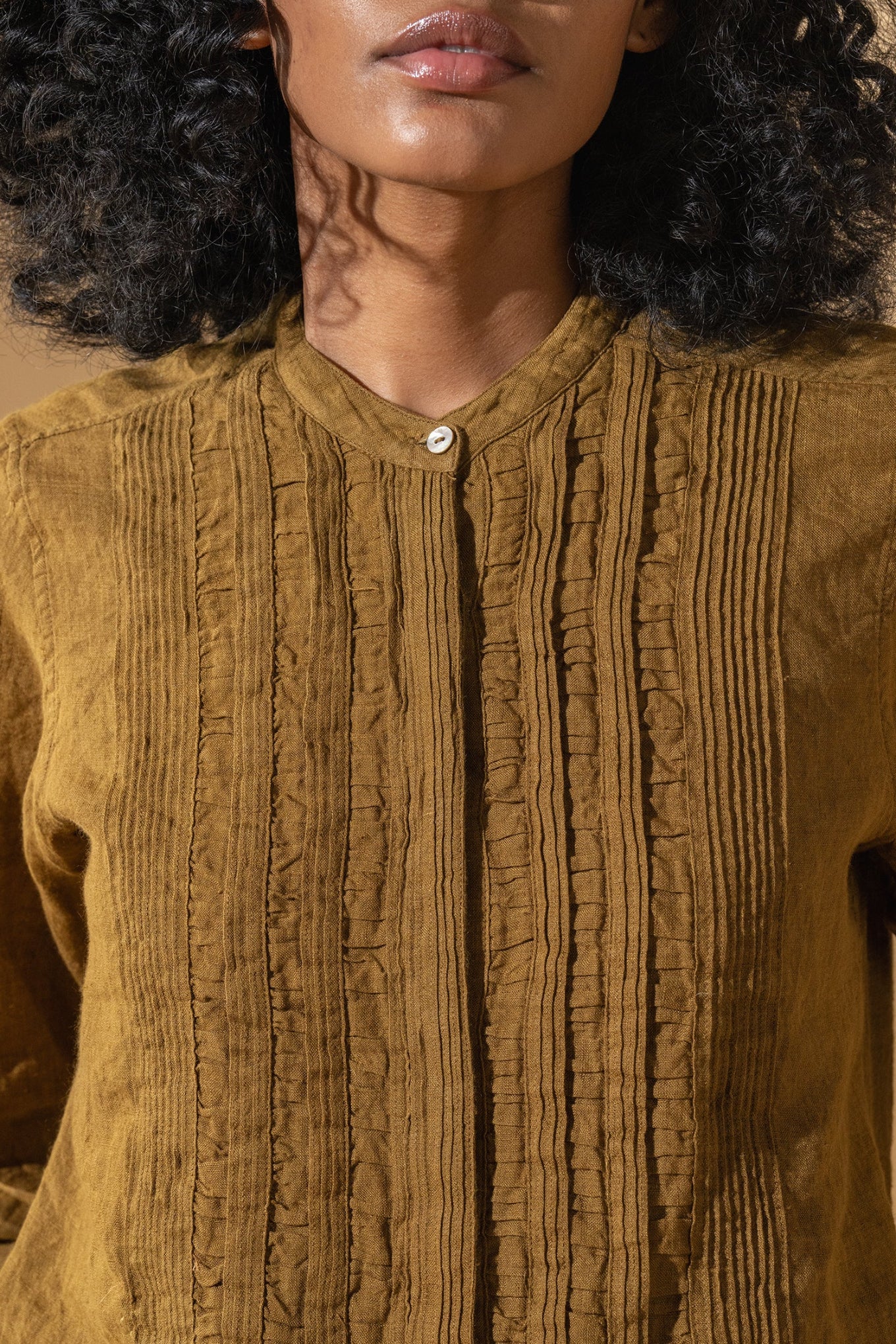 DVE Gargi blouse with pintucked and ruched details in mustard handloom linen.