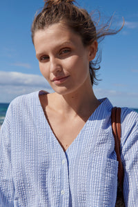 Noa Noa Mire shirt in cotton seersucker, V neck long sleeve button up on blue and white stripe.