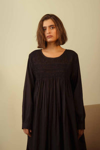 DVE Collection Tanisi long sleeved smocked dress in black paper cotton.