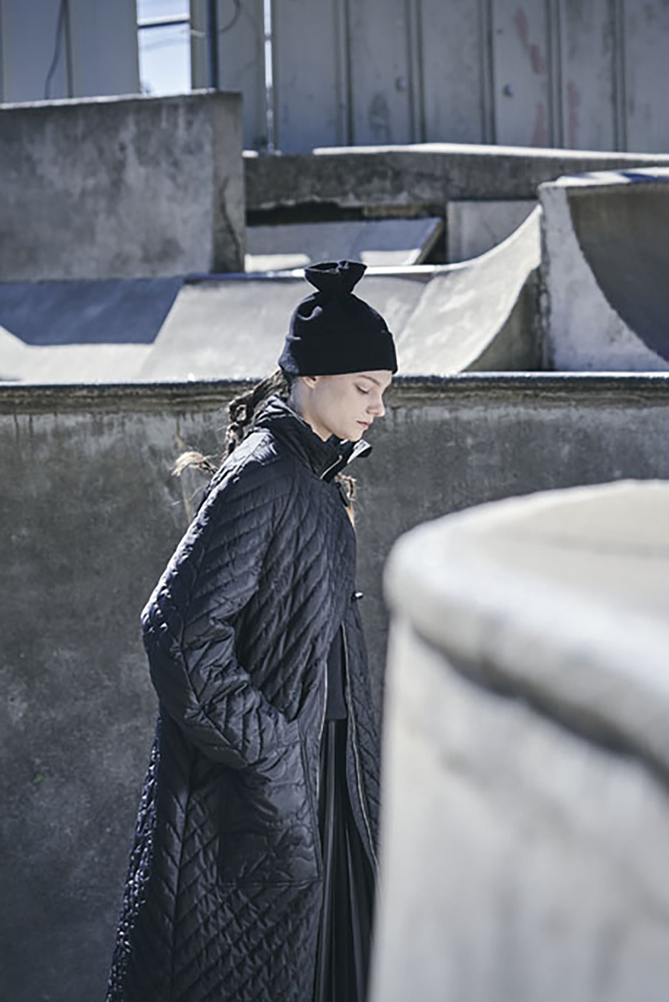 PCNQ black wool woven beanie with gather at top that releases to create a snood, made in Japan.
