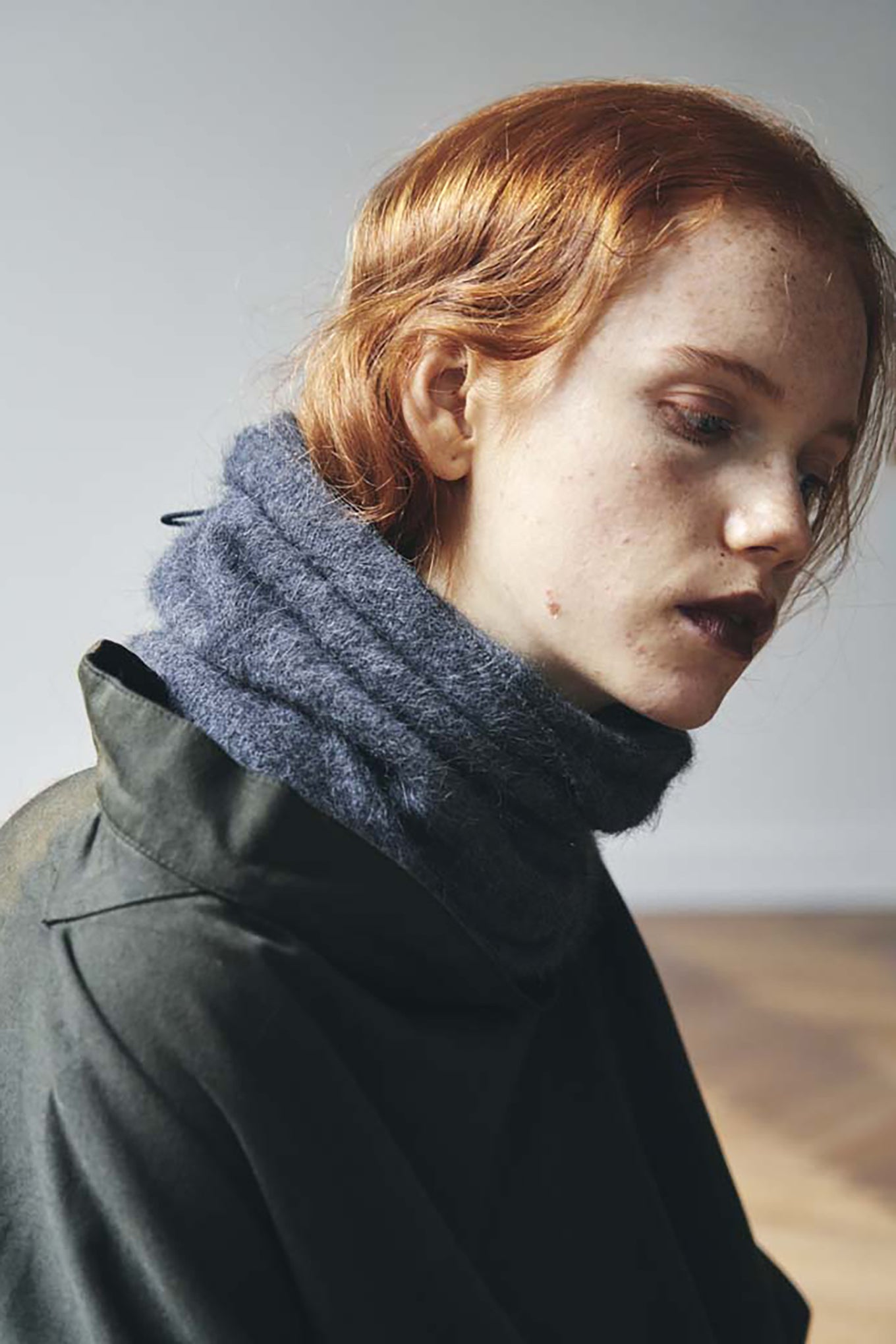 PCNQ black wool woven beanie with gather at top that releases to create a snood, made in Japan.