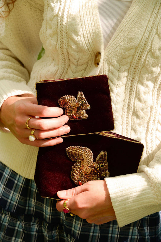My Doris burgundy brown velvet pouch with a beaded squirrel design.