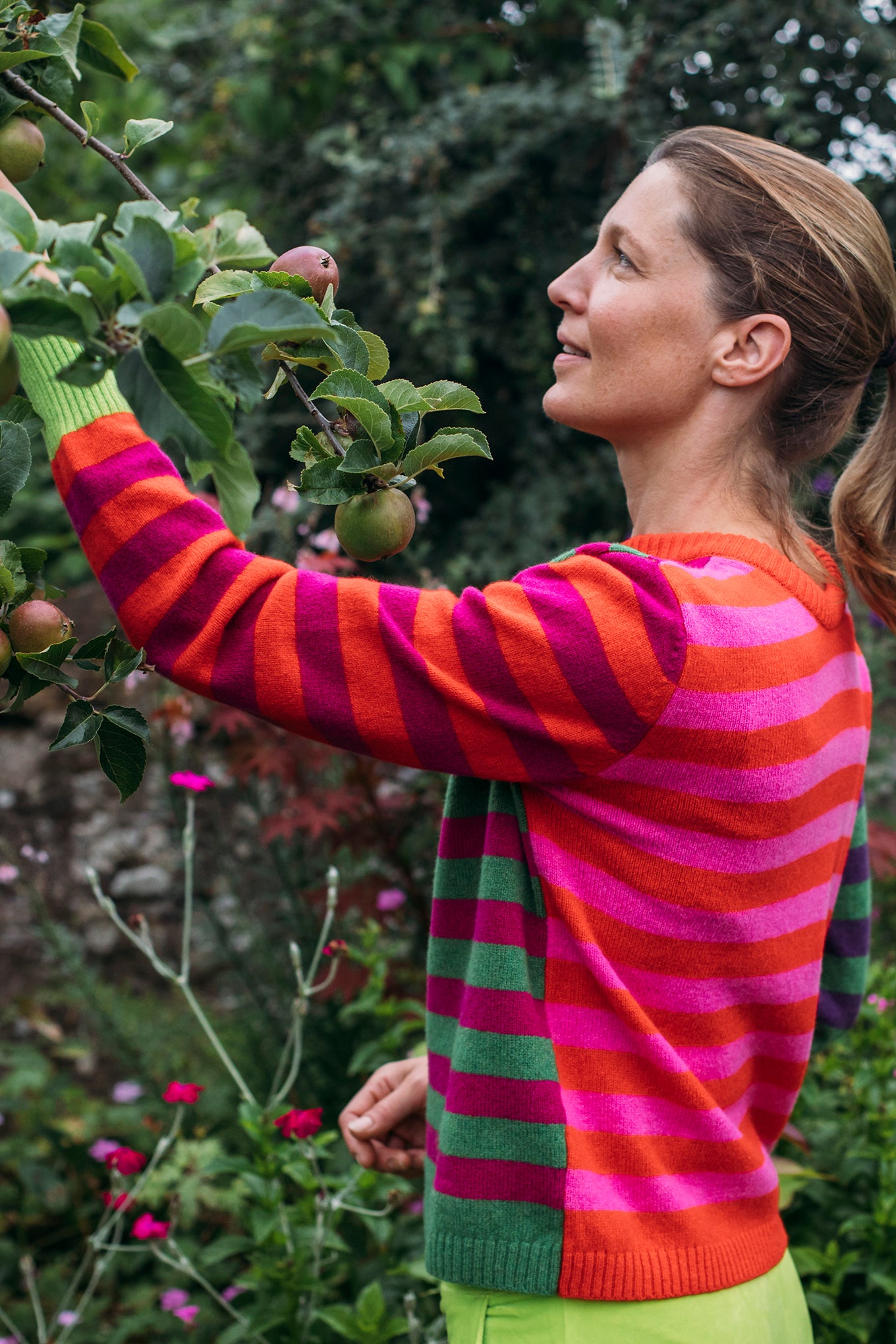 Eribe Stobo stripe reversible lambswool sweater in Rosa - pink and orange and red and purple anda green and fuchsia stripes.