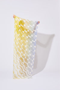 Ma Poesie Module scarf screen printed on organic cotton, in shades of yellow and orange.