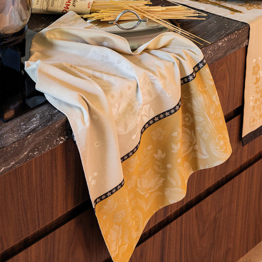 Le Jacquard Francais Feerie Christmas tea towel in yellow gold beige.