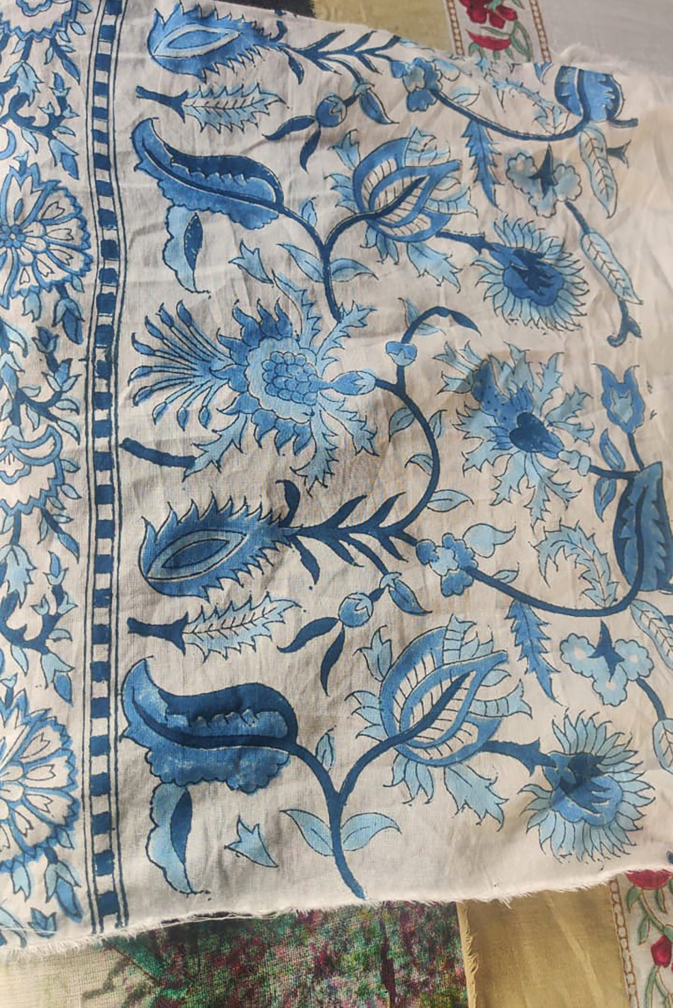 Ethically made artisan block print pure cotton napkin set, shades of blue on white floral design.