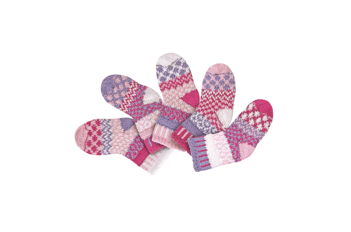 Solmate baby socks, two pairs and a spare knit from recycled cotton yarn in light pink, pink, purple and white.