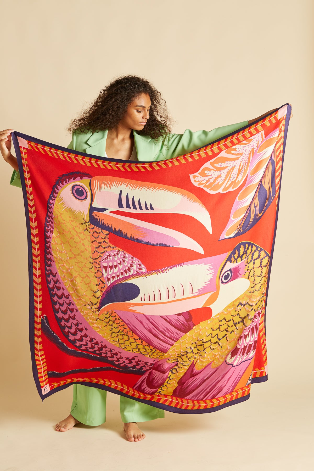 Inoui editions silk modal carre scarf Toucan, featuringpair of toucans on a vibrant vermilion red.