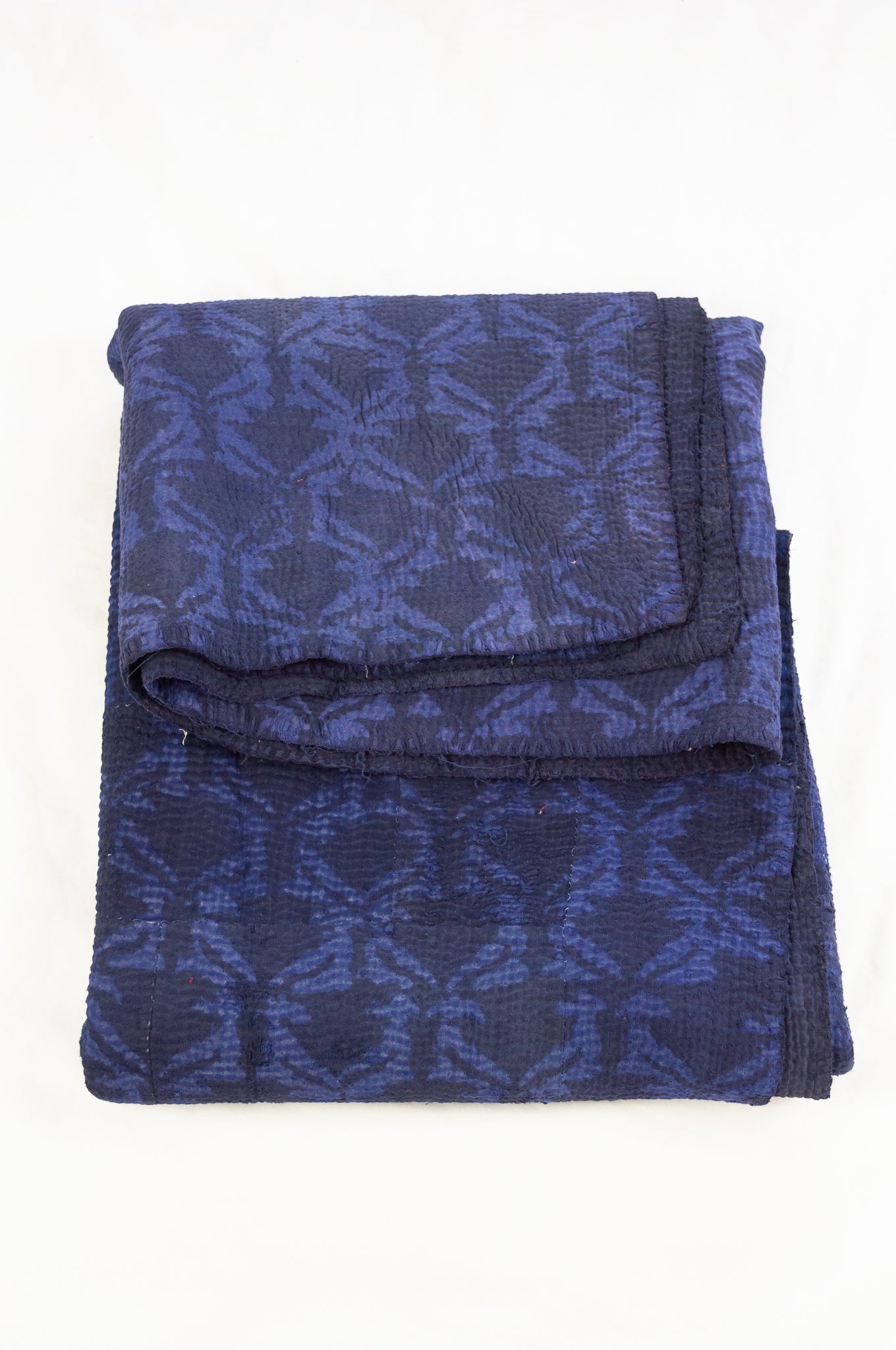 Vintage kantha quilt overdyed in dark double indigo mud resist blockprint, abstract floral.