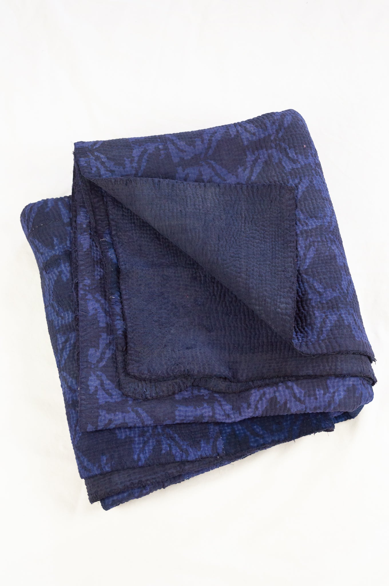 Vintage kantha quilt overdyed in dark double indigo mud resist blockprint, abstract floral.