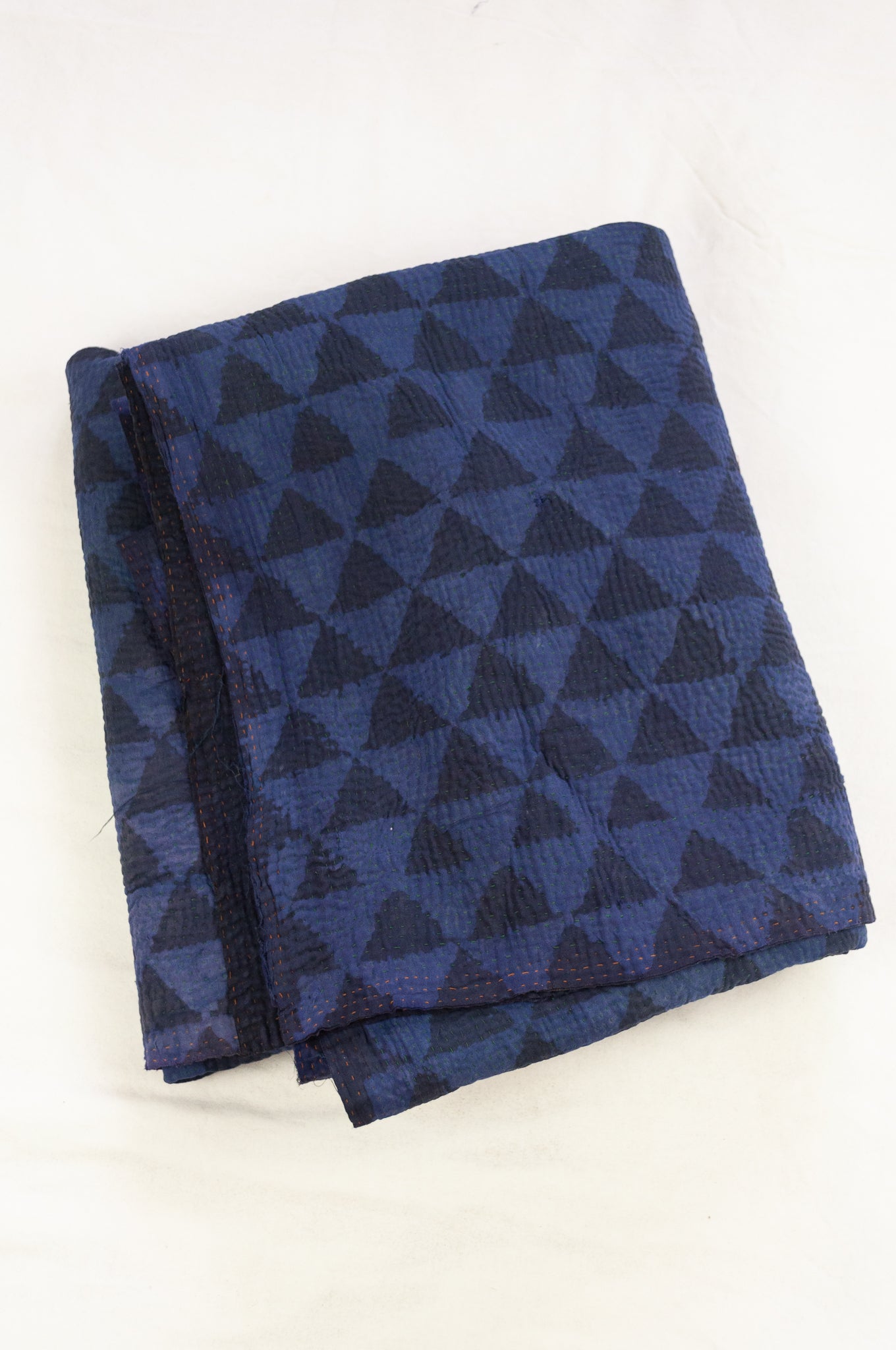 VIntage kantha quilt, overdyed in natural indigo using mud resist blockprint, triangle pattern.