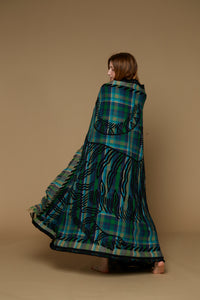 Inoui Editions wool throw, plaid in shades of blue and green with tiger silhouette in black.