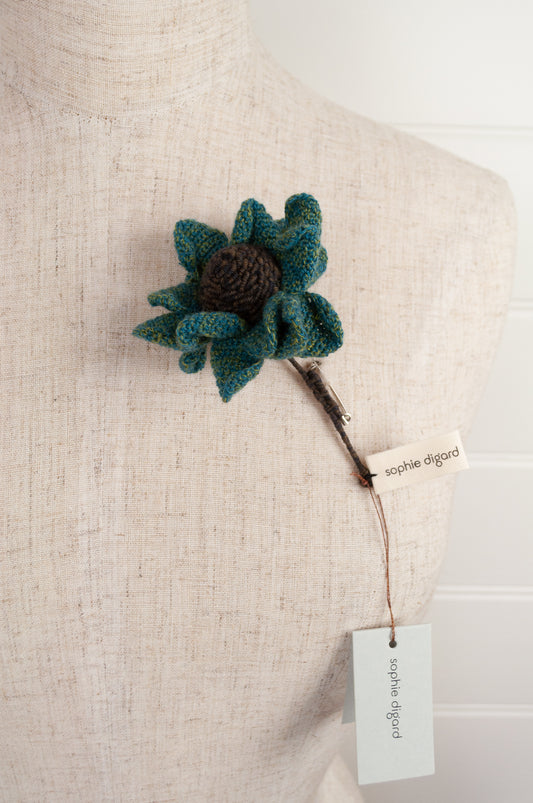 Sophie Digard brooch, made by hand in Madagascar, Asperule single flower crocheted in merino wool in deep turquoise with a chocolate brown centre.