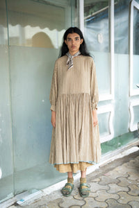Runaway Bicycle Yini dress in 50% cotton 50% silk beige stripe.