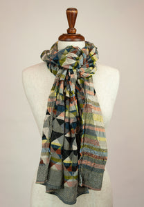 Létol French organic cotton scarf with a geometric Missoni inspired design in shades of red, green, gold, blue and black.