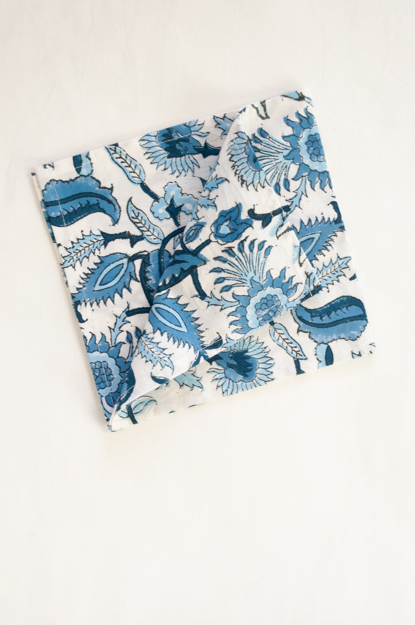Ethically made artisan block print pure cotton napkin set, shades of blue on white floral design.
