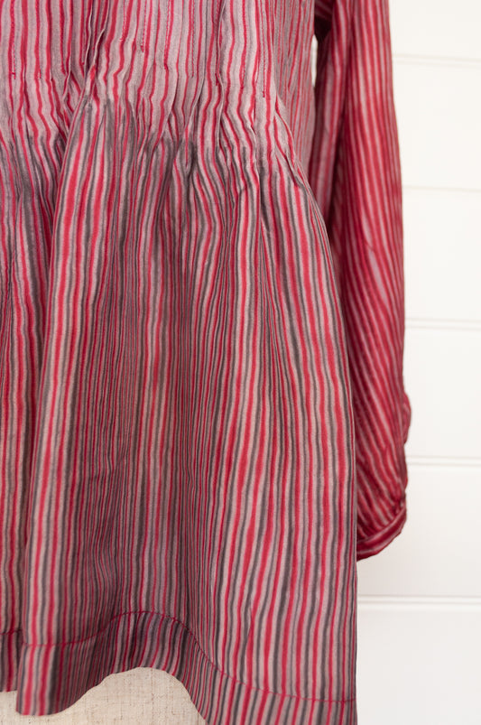 Juniper Hearth silk shibori Asha top with pin tucked bodice and long sleeves in deep raspberry red with pewter grey accents.