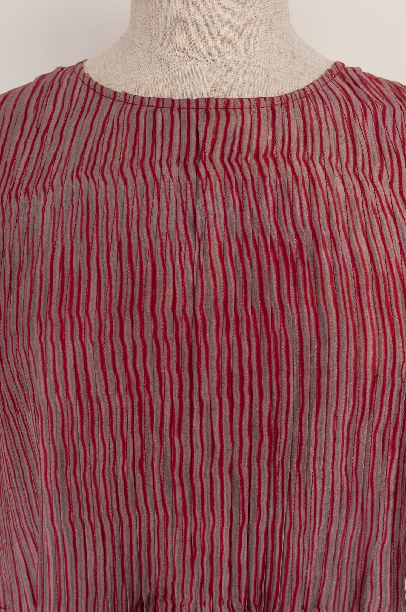 Juniper Hearth silk shibori Asha top with pin tucked bodice and long sleeves in deep raspberry red with pewter grey accents.