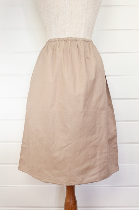 Knee length cotton voile half slip, elastic waist. In natural.