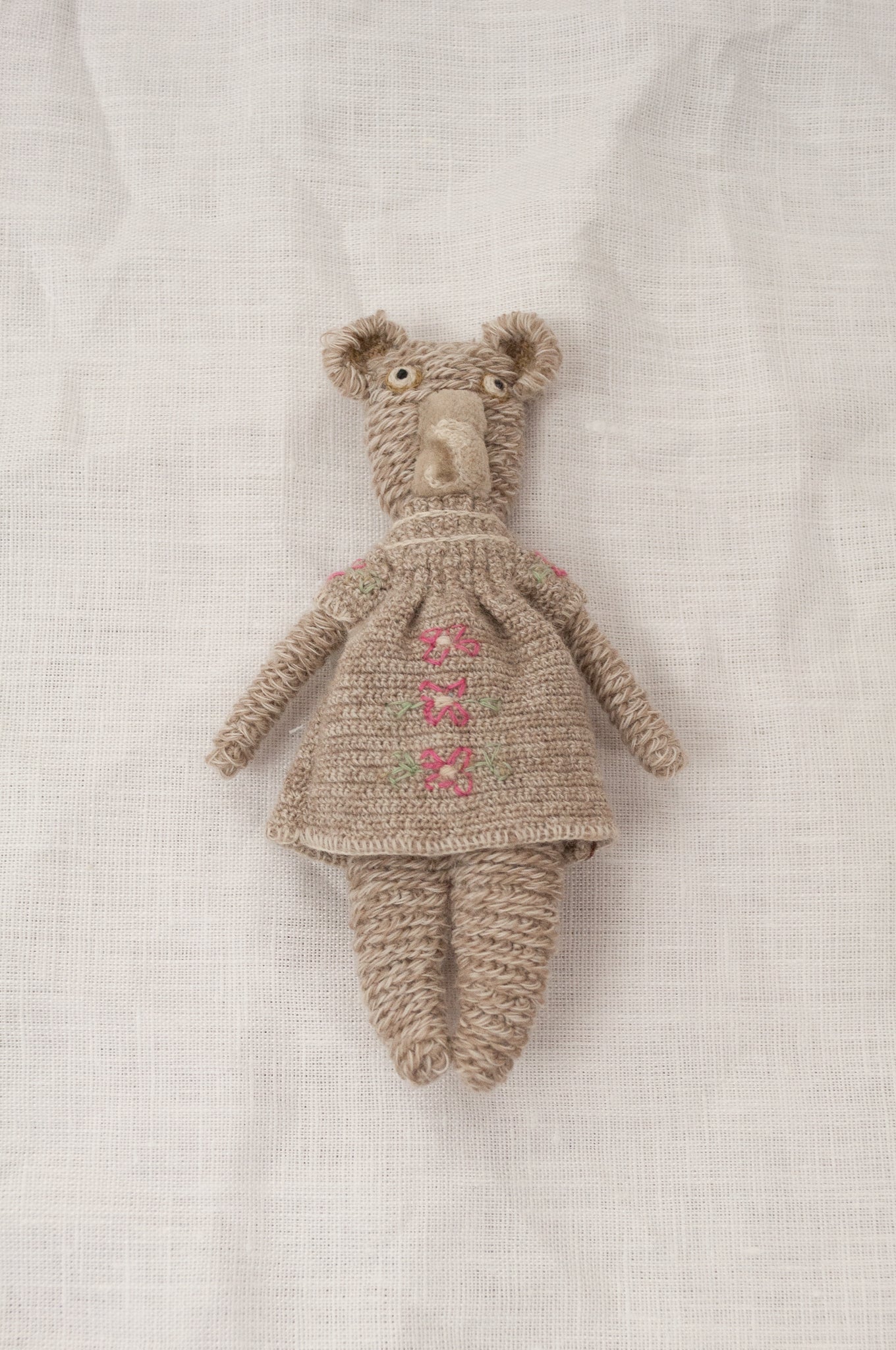 Sophie Digard crochet teddy bear, Pippa - oatmeal wool with matching dress featuring rose pink flowers.