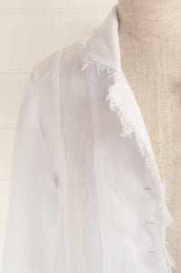Banana Blue long jacket duster coat in 100% European white linen, long sleeves half button up and fringed edges.