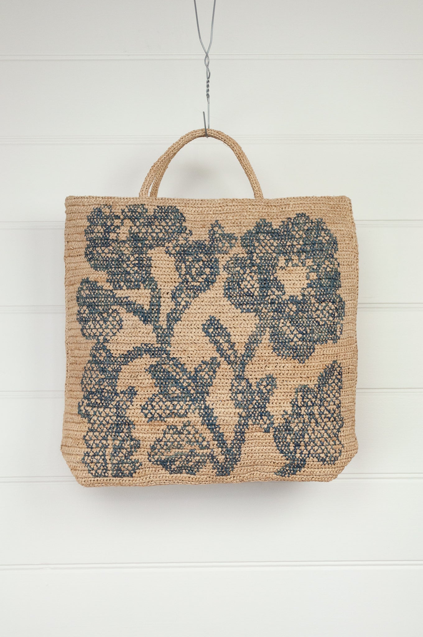 Sophie Digard crocheted raffia large square bag, teal floral embroidery on natural flax background.